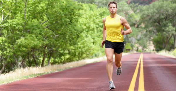 Man running down an empty road
