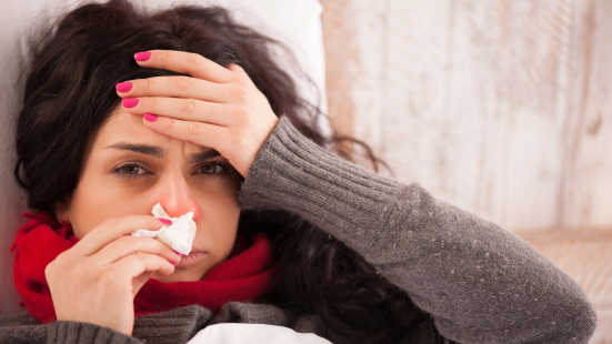 Sick woman with a tissue