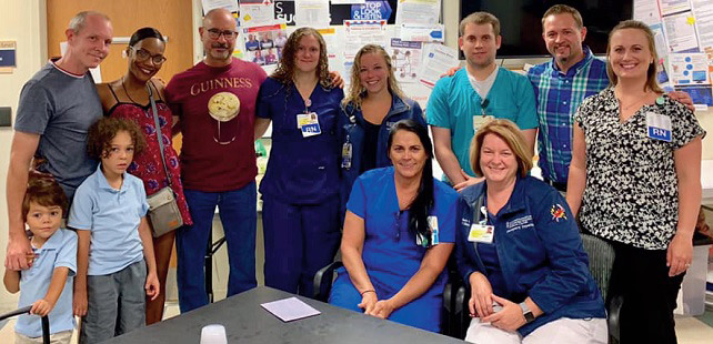 Group photo of donor Jeanette Kruezburg, her family and BWMC staff members