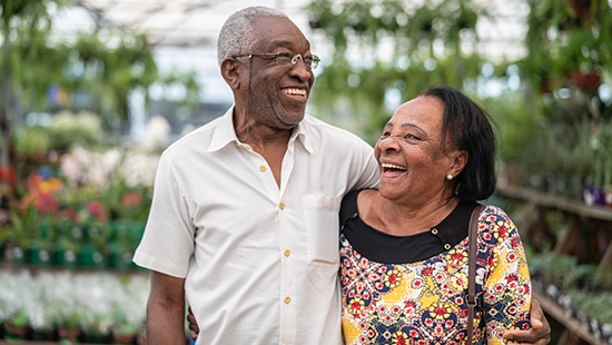 man and woman with plants