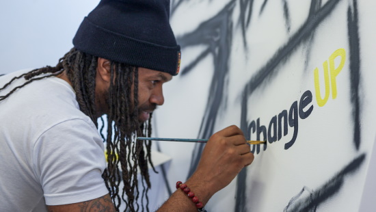 Artist painting changeUP logo