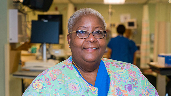 Nurse smiles at camera