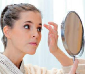 Women looking at mirror