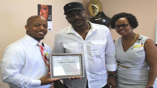 Mr. Mckenzie receiving recognition for being smoke free