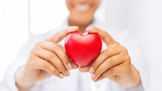 person holding a heart-shaped object