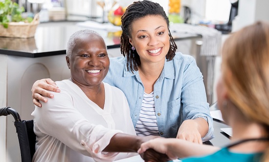 woman shaking hands with med tech