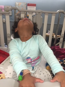 photo of Kayleigh in hospital crib