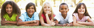 photo of kids smiling at the camera
