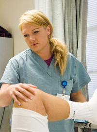 PT helping a patient stretch