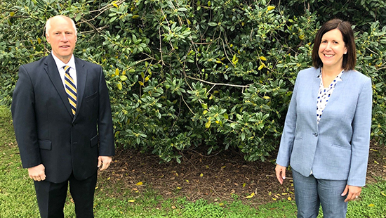 From left are Ken Kozel, president and CEO of University of Maryland Shore Regional Health and Sara Rich, president and CEO of Choptank Community Health System standing on a patch of grass, six feet apart.