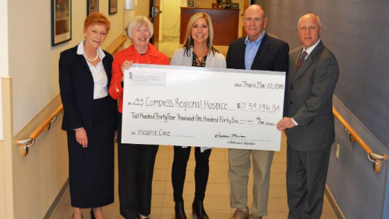 Hospice Officials being presented donation check
