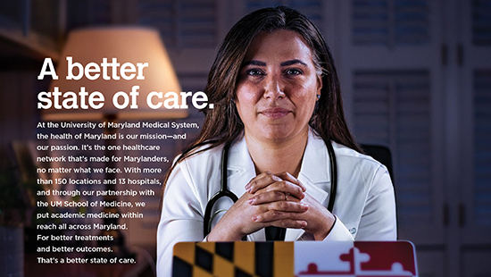 A doctor sits behind her laptop, with a lamp on behind her, alluding to long hours caring for patients