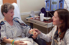 photo of a caregiver comforting a patient