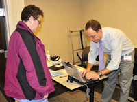 Photo of Chris Lindlsey registering a blood drive patient