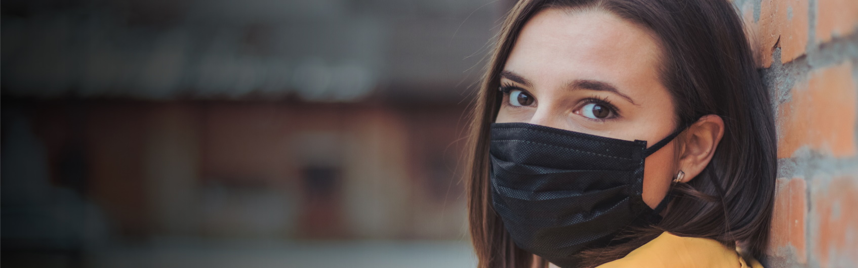 Young woman wearing a mask
