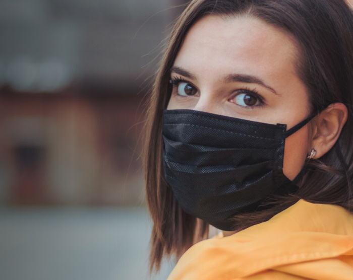 Young woman wearing a mask