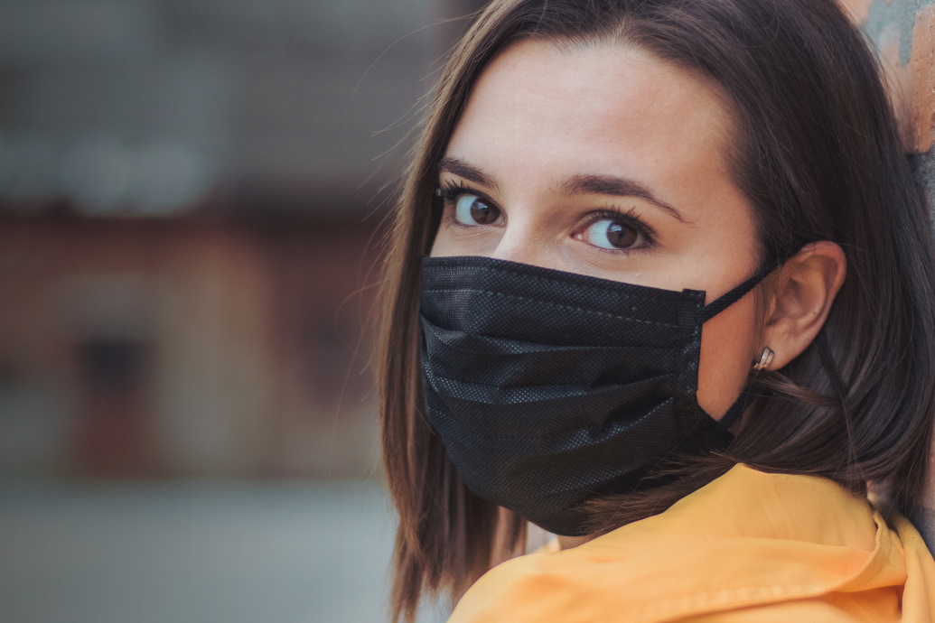 Young woman wearing a mask