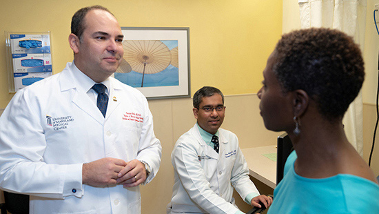 Lung cancer doctors meet with a patient