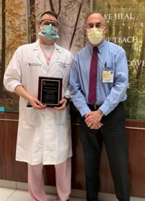 Emad Elsamadicy, MD receiving Fellow Physicians of the Year