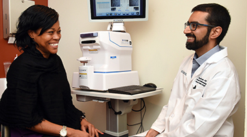 Ophthalmologist Dr. Munir speaking with a patient