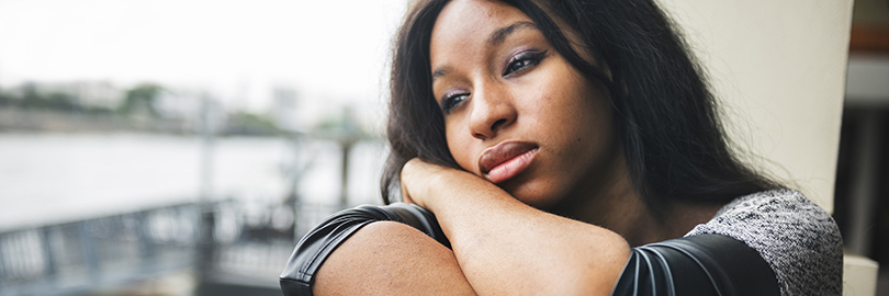 Woman who looks very sad because of postpartum depression