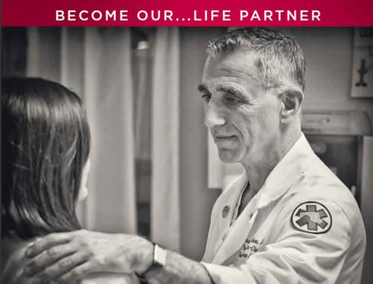 Photo of a EMT talking to a woman
